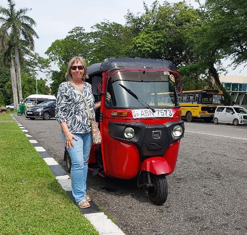 Our red tuk tuk on a Colombo outing — photograph 1