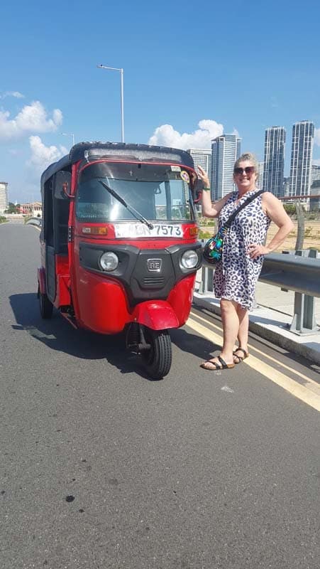 Our red tuk tuk on a Colombo outing — photograph 5